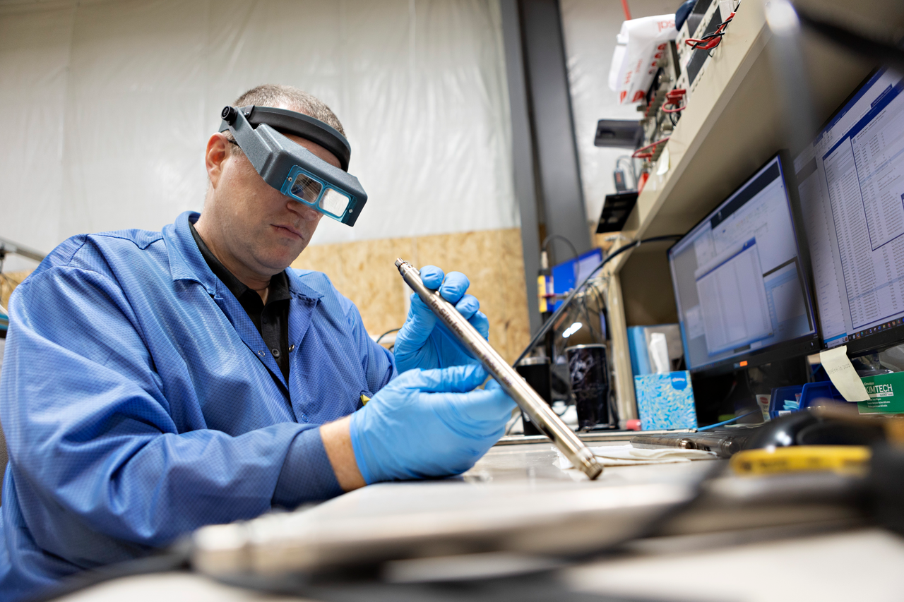 service tech examining AT200