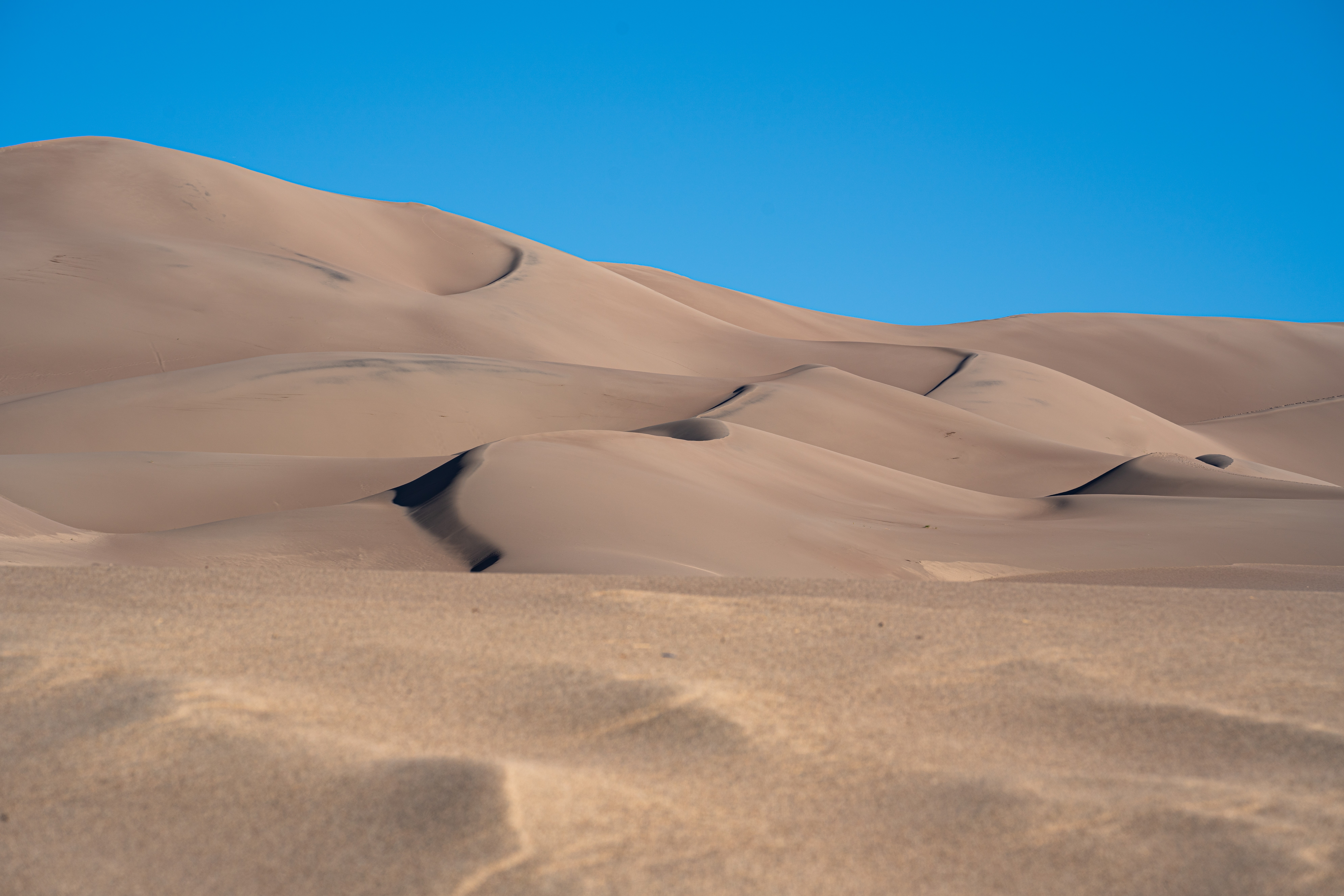 A Sanddune with clear skys.
